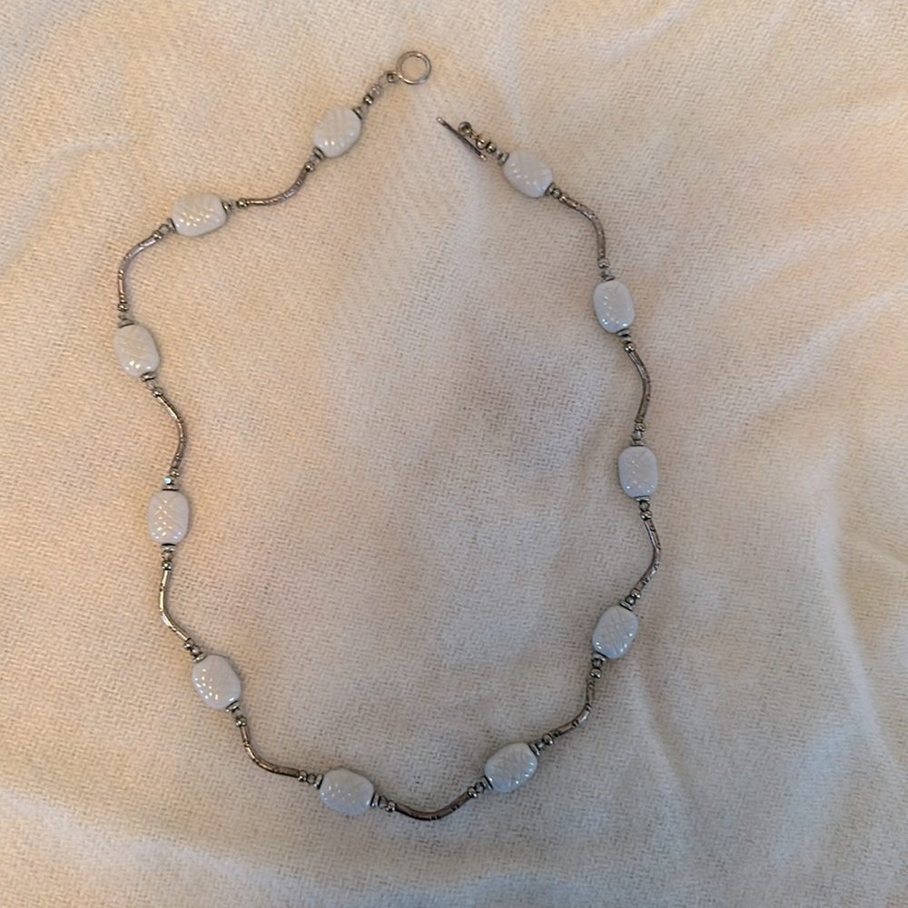 Pearlescent bead necklace on pewter-look chain.